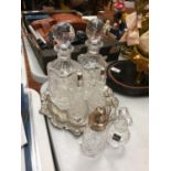 A MIXED COLLECTION OF GLASSWARE TO INCLUDE TWO DECANTERS A CRUET SET AND SUGAR SHAKER