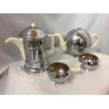 A FOUR PIECE RETRO CHROME TEA AND COFFEE POT SET TO INCLUDE SUGAR BOWL AND MILK JUG