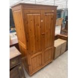 A MODERN PINE TWO DOOR WARDROBE, 39" WIDE