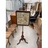 A VICTORIAN WALNUT TAPESTRY POLE SCREEN ON TRIPOD BASE