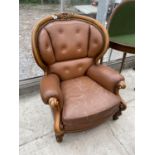 A VICTORIAN STYLE BUTTON-BACK WINGED EASY CHAIR ON FRONT CABRIOLE LEGS