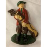 A PAINTED CAST IRON DOOR STOP IN THE SHAPE OF A GOLFER CARRYING HIS CLUBS