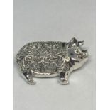 AN ORNATE MARKED SILVER PIG BROOCH