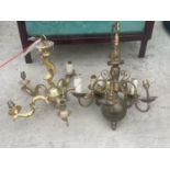 A PAIR OF DECORATIVE BRASS LIGHT FITTINGS