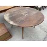 AN OVAL ERCOL DROP-LEAF DINING TABLE, 49X44"