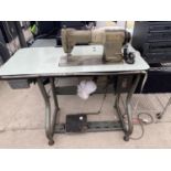 A BROTHER INDUSTRIES LTD INDUSTRIAL SEWING MACHINE AND TREDDLE TABLE