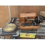 A VINTAGE DECORATIVE BEROMETER AND A VINTAGE SINGER SEWING MACHINE WITH WOODEN CARRY CASE