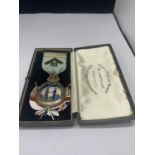 A HALLMARKED LONDON SILVER AND ENAMEL MEDAL AND ROBBON ENGRAVED TO REAR WITH ORIGINAL BOX FROM HANTS