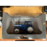 A BOXED UNIVERSAL HOBBIES DIE CAST FORD TRACTOR 1:32