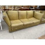 A GREEN LEATHER KNOWLE THREE SEATER SETTEE WITH STUDDED DECORATION