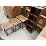 A NEST OF THREE OAK TABLES ON TURNED LEGS AND NARROW FOUR TIER OPEN BOOKCASE, 14" WIDE
