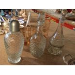 THREE GLASS DECANTERS