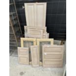 A LARGE ASSORTMENT OF OAK EFFECT CUPBOARD DOORS