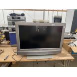A 26" SONY BRAVIA TELEVISION WITH REMOTE CONTROL