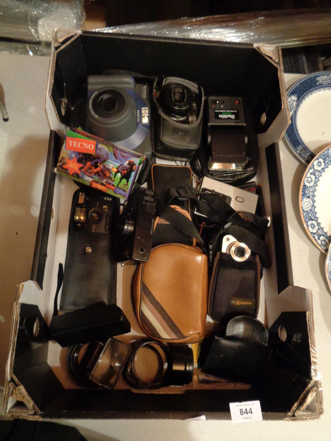 A LARGE BOX CONTANING CAMERAS AND RELATED EQUIPMENT