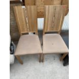 A PAIR OF MODERN OAK FRAMED DINING CHAIRS