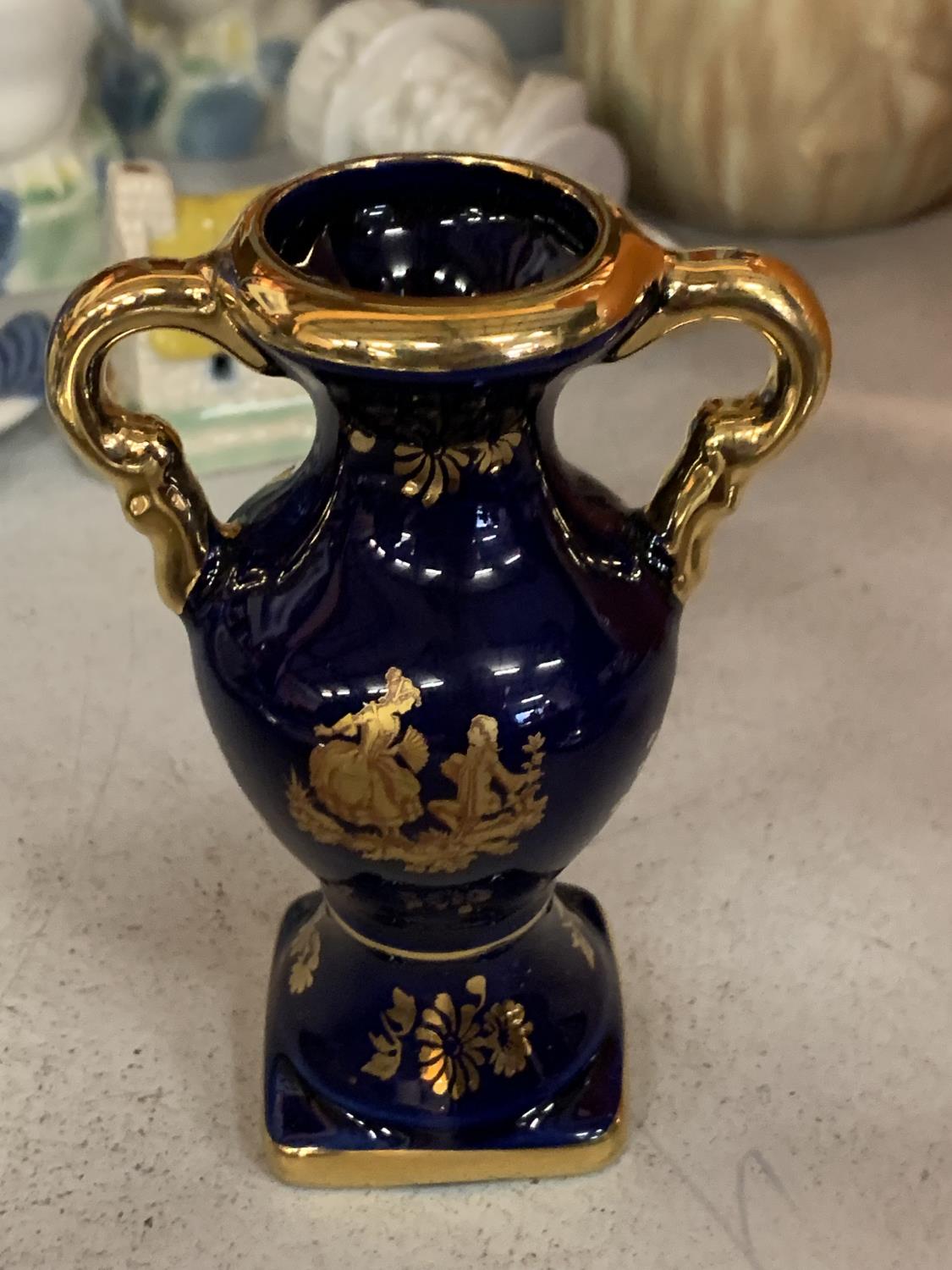 A BLUE AND GOLD LIMOGES MININ URN