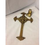 A BRASS CRUCIFIX AND A BRASS CALENDER