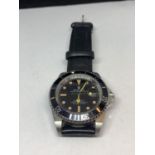 A GENTS FASHION WRIST WATCH SEEN WORKING BUT NO WARRANTY