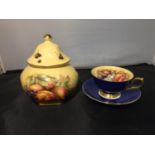 TWO GILDED AYNSLEY FRUIT DECORATED ITEMS TO INCLUDE A CUP AND SAUCER AND A LIDDED JAR