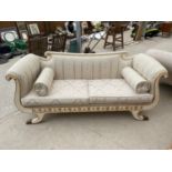 A 19TH CENTURY STYLE SCROLL END COUCH WITH GOLD TRIM DECORATION AND PAW FEET
