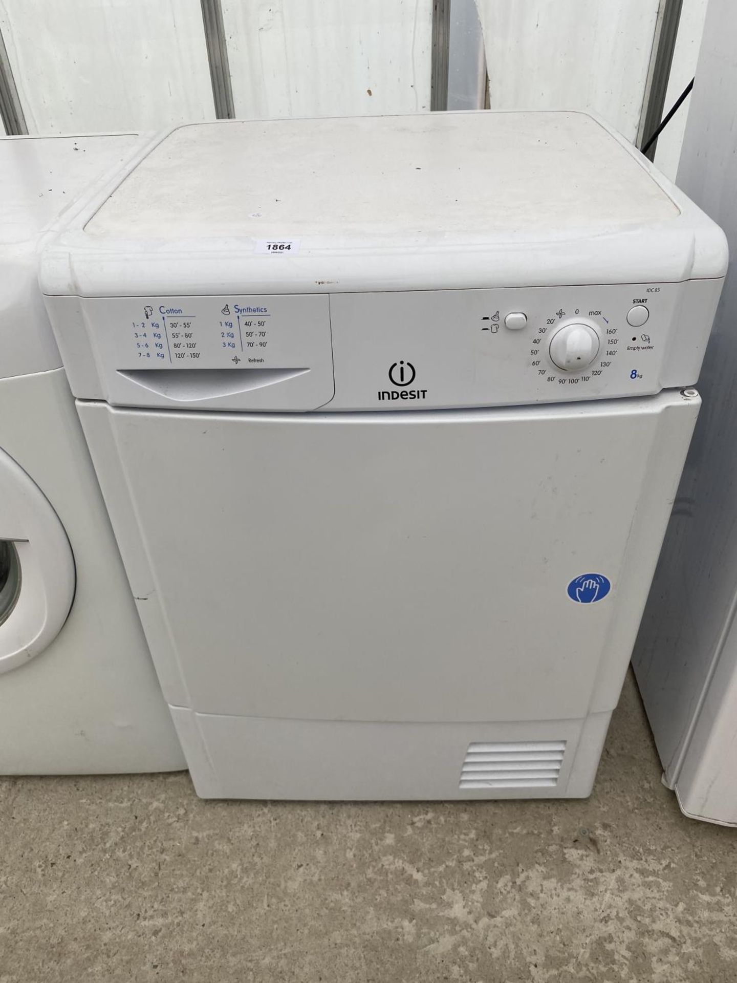 A WHITE INDESIT CONDENSOR DRYER BELIEVED IN WORKING ORDER BUT NO WARRANTY