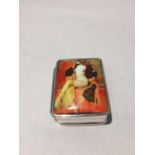 A MARKED 925 SILVER PILL BOX WITH AN ENAMEL EROTIC DESIGN TOP