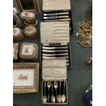A COLLECTION OF THREE BOXED CUTLERY ITEMS INCLUDING TWELVE KNIVES AND SIX SPOONS
