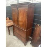 A 19TH CENTURY MAHOGANY PRESS CUPBOARD WITH TWO SHORT AND TWO LONG DRAWERS TO THE BASE