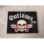 A CAST IRON SIGN - OUTLAWS