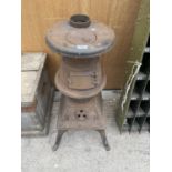 A VINTAGE CAST IRON POT BELLIED STOVE (H:75CM)