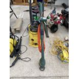 A KARCHER K4.600 PRESSURE WASHER AND A BLACK AND DECKER GRASS STRIMMER