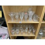 AN ASSORTMENT OF GLASS WARE TO INCLUDE SHERRY GLASSES, WINE GLASSES ETC