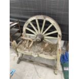 A VINTAGE WOODEN GARDEN BENCH WITH CART WHEEL BACK