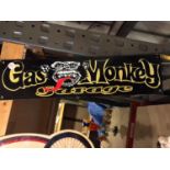 A TIN GAS MONKEY GARAGE SIGN