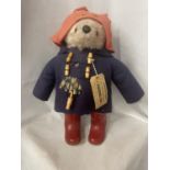 A PADDINGTON BEAR FIGURE WITH LABEL STATING GABRIELLE DESIGNS 1972, DESIGN NUMBER 957892