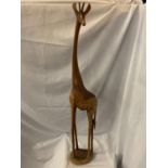 A TALL WOODEN GIRAFFE (REPAIR TO FOOT)