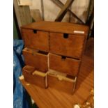 A WOODEN TRINKET BOX WITH SIX SMALL DRAWERS H: 30CM W:31CM