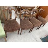 A SET OF FOUR VICTORIAN WALNUT DINING CHAIRS ON TURNED AND FLUTED FRONT LEGS