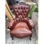 A VICTORIAN STYLE BUTTON-BACK FIRESIDE CHAIR