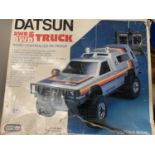 A BOXED RADIO CONTROLLED RV PICK UP 2WD AND 4WD TRUCK