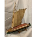 A HANDMADE NORFOLK BROADS WHERRY BOAT ON A STAND