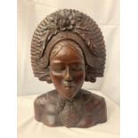 A HEAVILY CARVED BUST OF A BALI LADY H:46CM