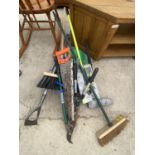 AN ASSORTMENT OF GARDEN TOOLS TO INCLUDE SHEARS, A RAKE AND A HOE ETC