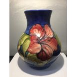 A LARGE WALTER MOORCROFT BALUSTER FORM VASE DECORATED IN THE ?HIBISCUS? PATTERN, ORIGINAL
