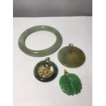 FOUR VARIOUS PIECES OF JADE TO INCLUDE A BANGLE AND THREE PENDANTS