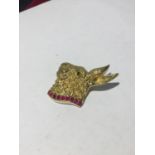 A SILVER GILT PENDANT IN THE FORM OF A HARE WITH A PINK STONE COLLAR