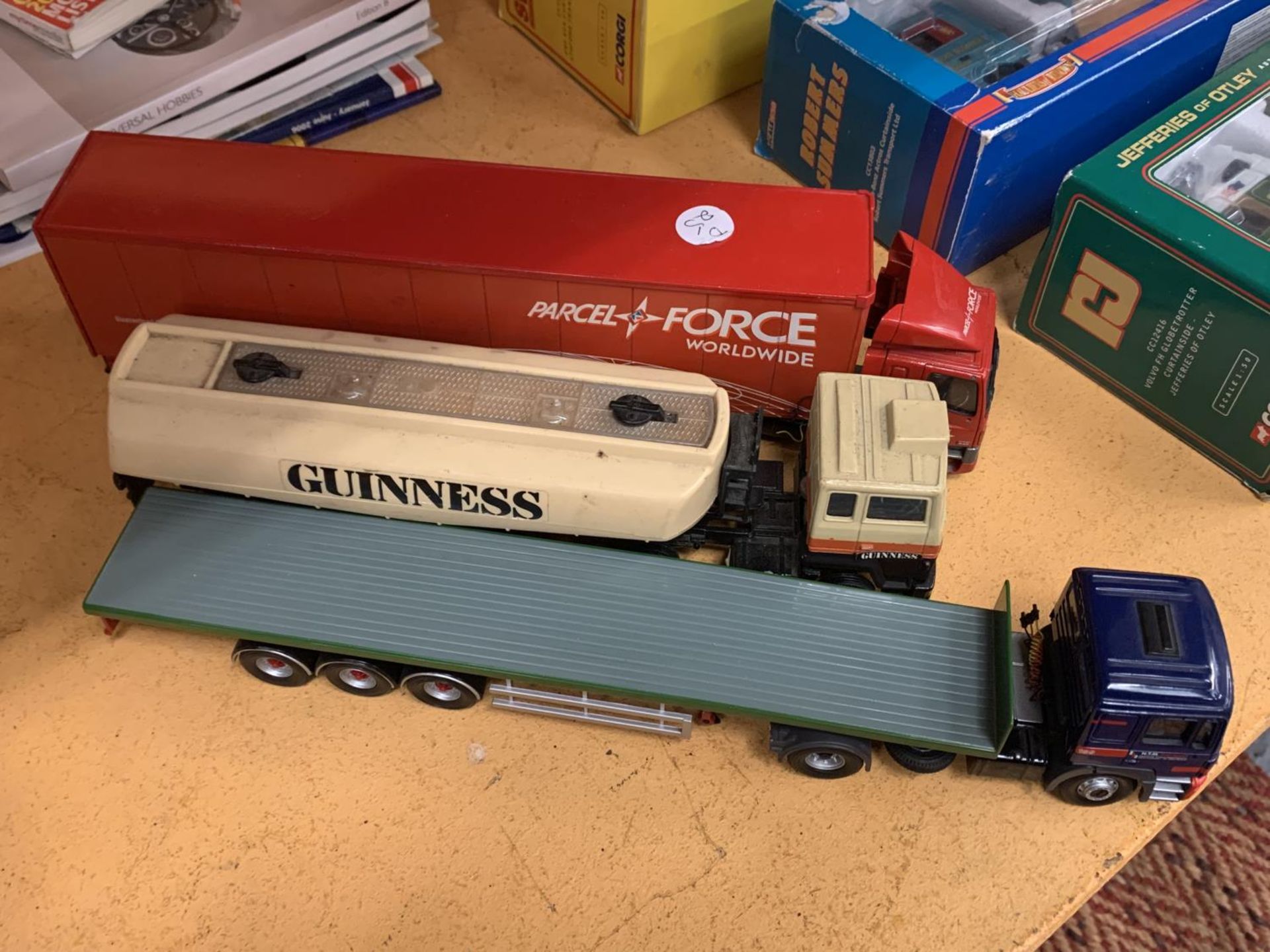 THREE CORGI WAGONS TO INCLUDE A GUINESS, PARCELFORCE AND FLATBED