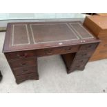 A REPRODUCTION MAHOGANY TWIN PEDESTAL DESK ENCLOSING NINE DRAWERS, WITH INSET LEATHER TOP, 48X24"