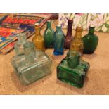 A COLLECTION OF NINE MINIATURE COLOURED GLASS BOTTLES
